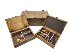 Two metal bound pine boxes containing six carved and painted fishing lures and other metal lures
