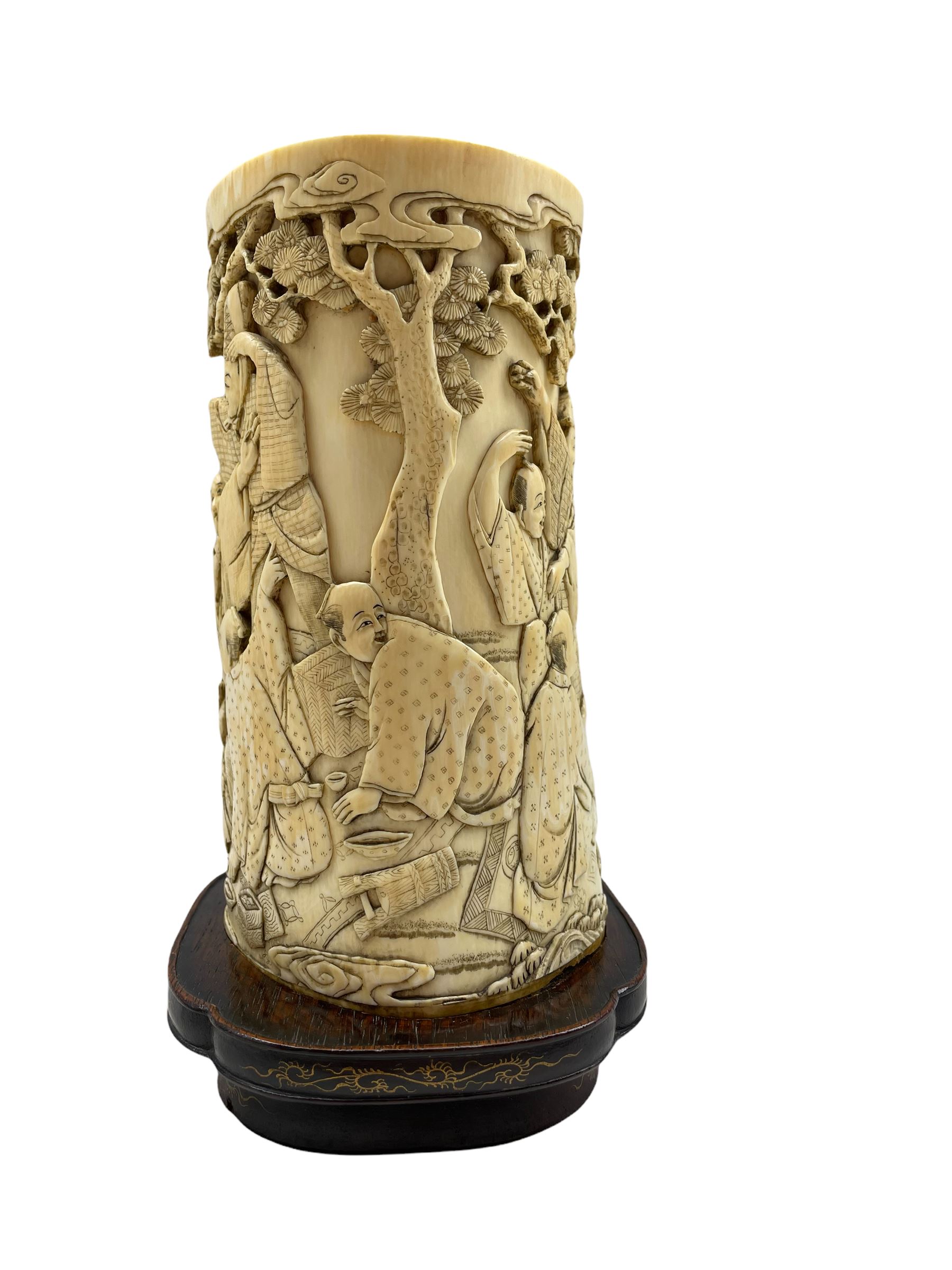 19th century Japanese ivory tusk vase finely carved with a continuous scene of figures gathered outs - Image 2 of 7