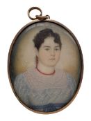 19th century miniature oval head and shoulders portrait on ivory of a lady wearing a coral bead neck