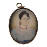 19th century miniature oval head and shoulders portrait on ivory of a lady wearing a coral bead neck