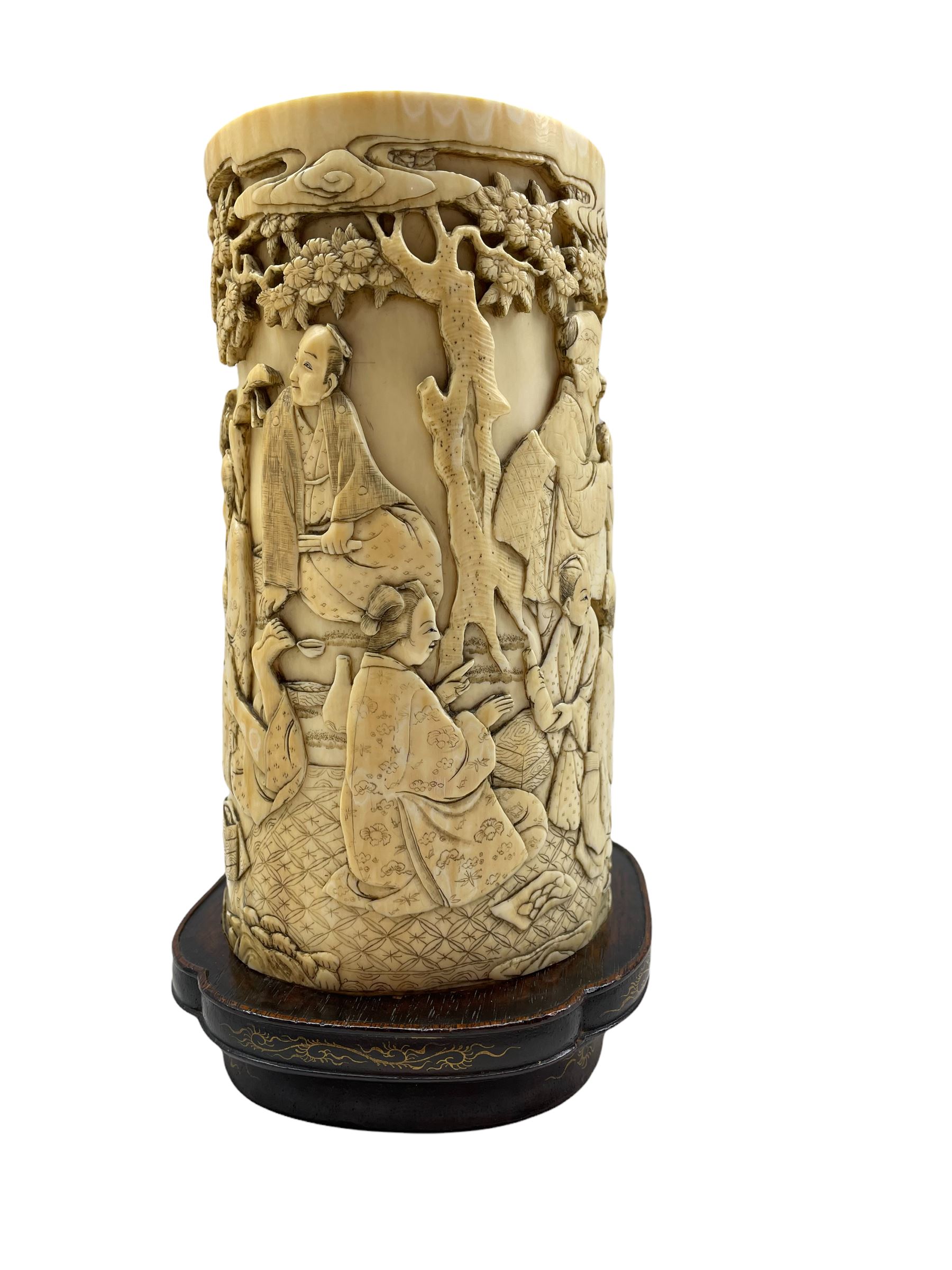 19th century Japanese ivory tusk vase finely carved with a continuous scene of figures gathered outs - Image 4 of 7