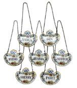 Set of seven Coalport porcelain decanter labels: Brandy