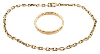 Gold wedding band and a gold link bracelet