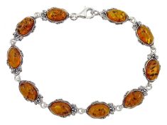 Silver oval Baltic amber bracelet