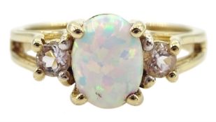 9ct gold three stone oval opal and white topaz ring