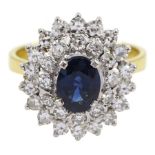 Gold oval sapphire and round brilliant cut diamond cluster ring