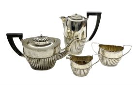 Silver four piece tea set of oval design with half body reeded decoration