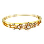 Early 20th century gold split pearl hinged bangle