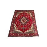 Hand knotted Persian rug from Tabriz region with red field