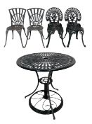 Black painted aluminium garden table and together with two pairs of chairs painted green
