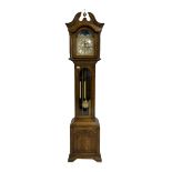 A late 20th century oak cased Grandmother clock with a swan's neck pediment and ball and spire finia