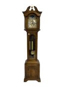A late 20th century oak cased Grandmother clock with a swan's neck pediment and ball and spire finia