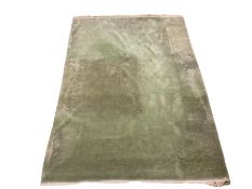 Chinese washed woollen green ground rug with floral and foliate design 310cm x 445cm