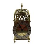 A 20th century spring driven table clock in the style of an early 17th century Lantern clock