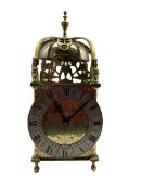A 20th century spring driven table clock in the style of an early 17th century Lantern clock
