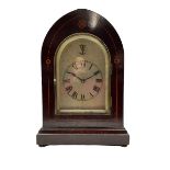 An Edwardian mahogany mantle clock with contrasting satinwood inlay c1905