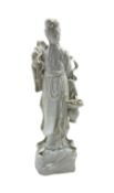 Chinese blanc de chine standing female figure holding a basket of flowers H37cm