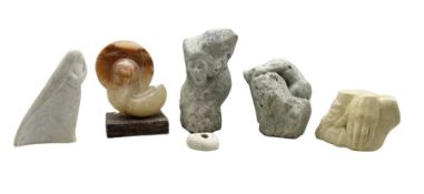 Five carved stone sculptures by Ronald W. Southgate including a carved alabaster sculpture on wooden