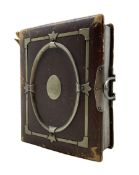 Leather photograph album and contents including military portrait by J Raucher
