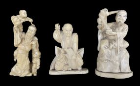 19th century Japanese carved ivory okimono of a seated figure with a monkey on his shoulder and with
