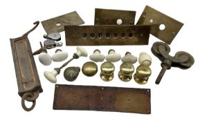 Collection of door furniture including ceramic and brass handles