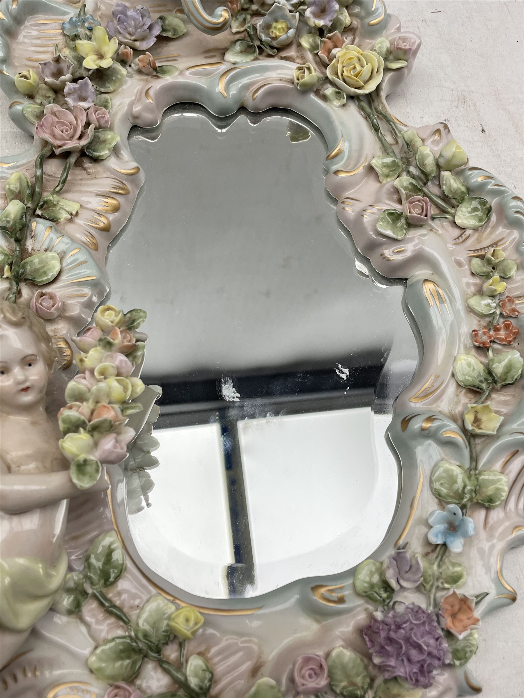 Pair Sitzendorf scroll shaped porcelain wall mirrors applied with flowers and Putti - Image 2 of 3