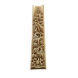 19th century Chinese ivory wrist rest intricately carved with figures and buildings