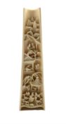 19th century Chinese ivory wrist rest intricately carved with figures and buildings
