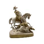 Large Royal Dux porcelain figure of a Huntsman on horseback with three hounds running alongside