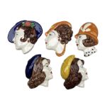 Set of five Moorland Chelsea pottery wall plaques in the style of 1920s ladies