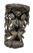 South-east Asian softwood carving of two figures holding flowers