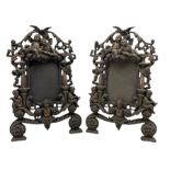 Pair of Victorian ornate iron photograph frames with a coppered finish and hinged struts Rd. No. 553