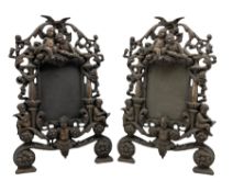 Pair of Victorian ornate iron photograph frames with a coppered finish and hinged struts Rd. No. 553