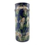 Continental glazed earthenware stick stand of cylindrical form painted with Calla Lily's