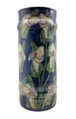 Continental glazed earthenware stick stand of cylindrical form painted with Calla Lily's