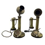 Two brass candlestick telephones with rotary dials