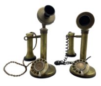 Two brass candlestick telephones with rotary dials