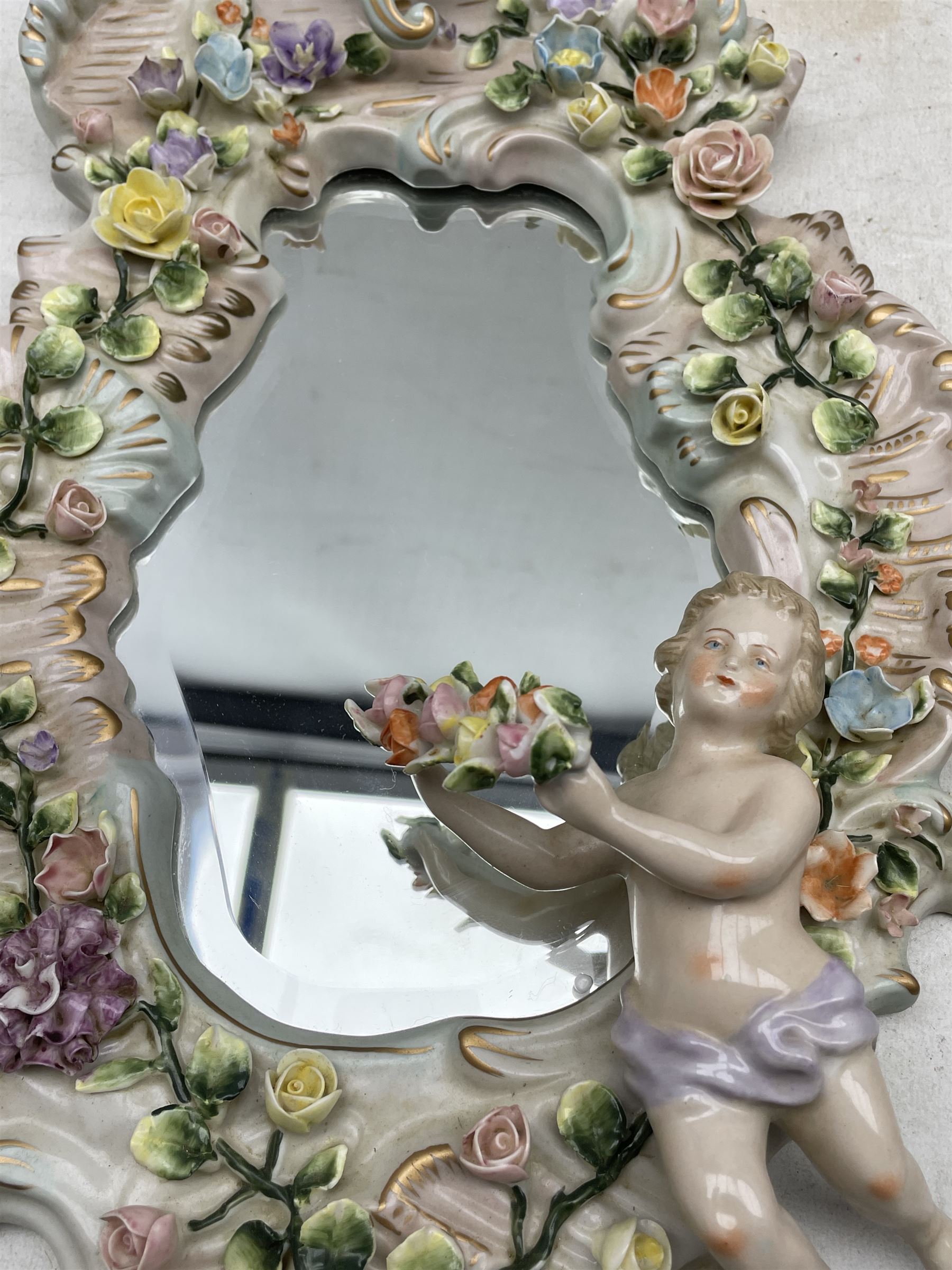 Pair Sitzendorf scroll shaped porcelain wall mirrors applied with flowers and Putti - Image 3 of 3