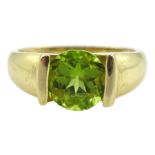 14ct gold half bezel set single stone peridot ring