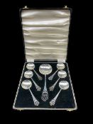 Cased set of Art Deco silver comprising six dessert spoons and serving spoon with pierced finials Bi