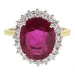 18ct gold oval ruby and round brilliant cut diamond cluster ring