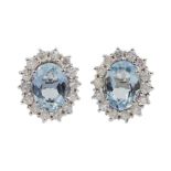 Pair of 18ct white gold oval aquamarine and diamond cluster stud earrings