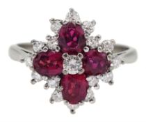White gold oval ruby and round brilliant cut diamond cluster ring