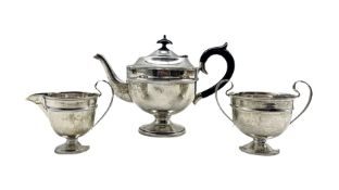 Silver three piece tea set of circular design