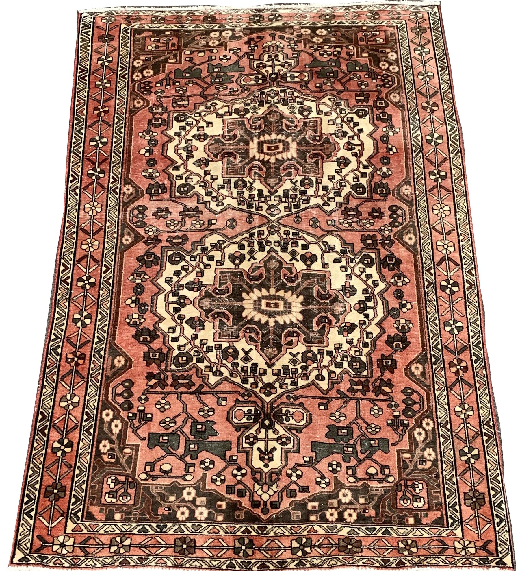 Vintage Persian faded red ground rug