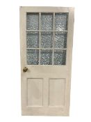 Cream and green painted wooden door with distorted glass windows