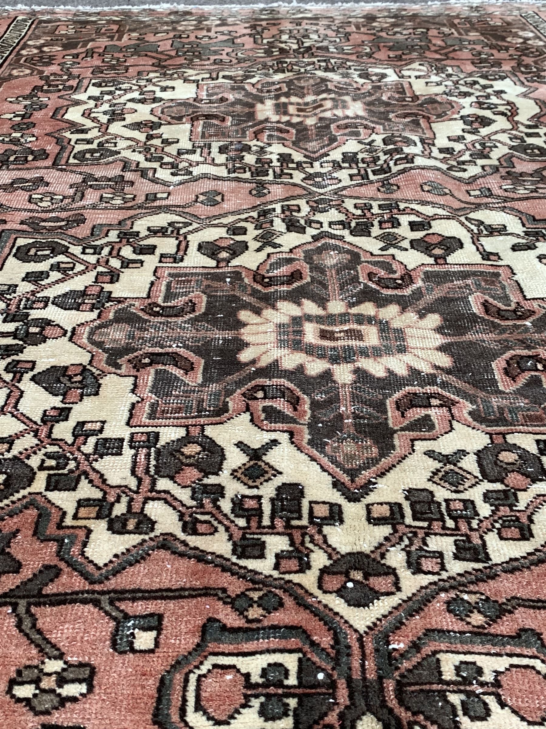 Vintage Persian faded red ground rug - Image 2 of 3