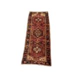 Hand knotted Persian runner rug from the Heriz region