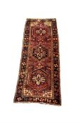 Hand knotted Persian runner rug from the Heriz region