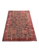 Handknotted Persian rug from Sanandaj region with five red medallions